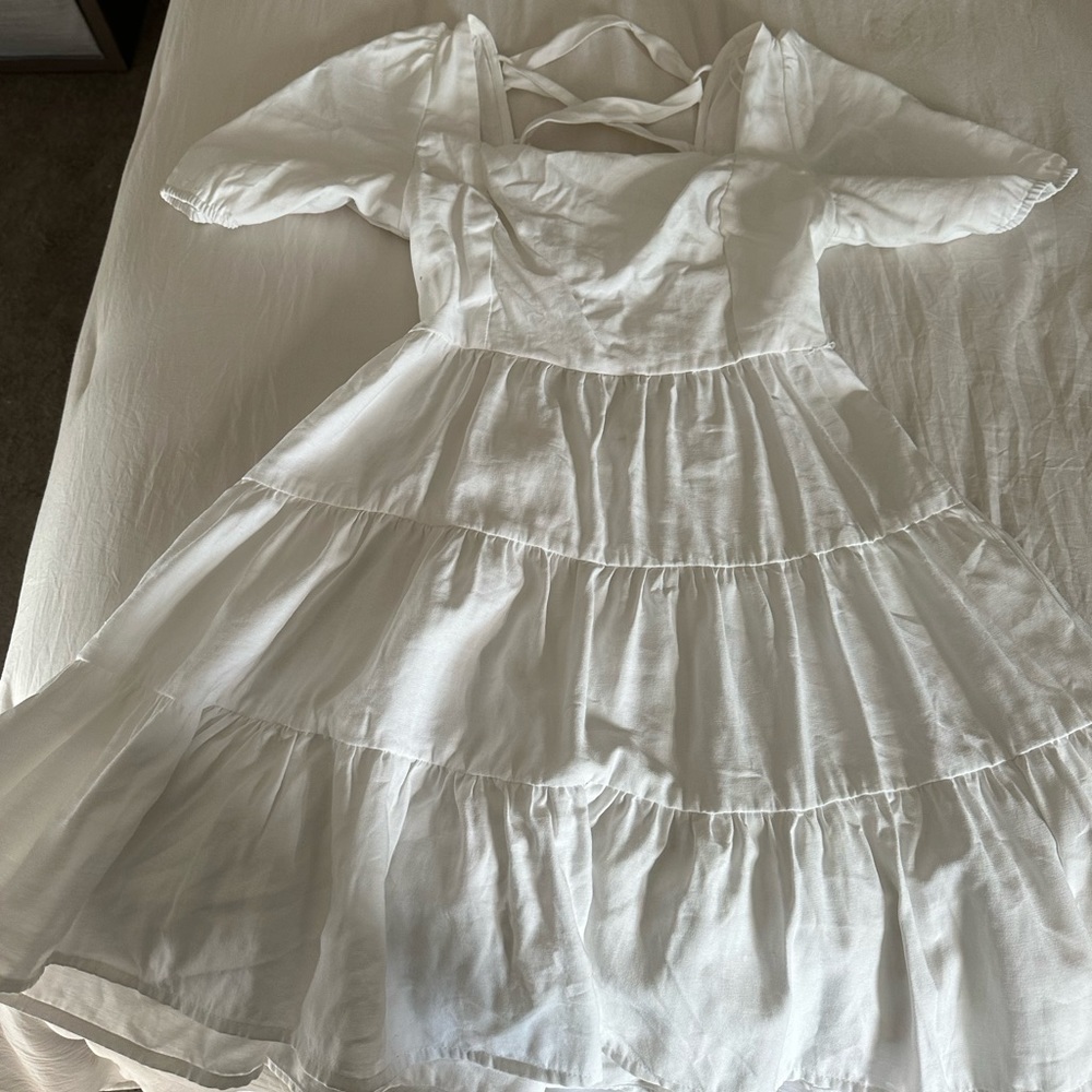 white mini open back dress